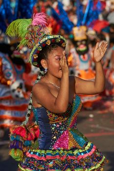 Arica, Chile - January 23, 2016: Morenada dance group performing a traditional ritual dance as part of the Carnaval Andino con la Fuerza del Sol in Arica, Chile.