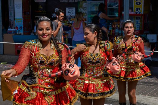 ARICA, CHILE - JANUARY 23, 2016: Young women performing the Diablada (dance of the devil) as part of the Carnaval Andino con la Fuerza del Sol in Arica, Chile. The dance originates in Oruro, Bolivia