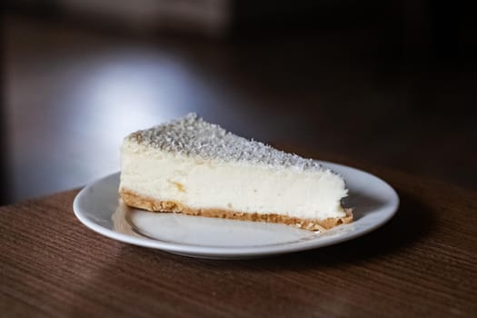 White cheesecake on a plate close up, copy space