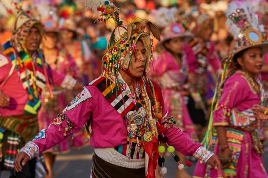 Arica, Chile - January 23, 2016: Tinkus dancing group in colourful costumes performing a traditional ritual dance as part of the Carnaval Andino con la Fuerza del Sol in Arica, Chile.