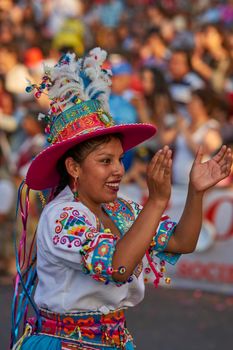 Arica, Chile - January 23, 2016: Tinkus dancing group in colourful costumes performing a traditional ritual dance as part of the Carnaval Andino con la Fuerza del Sol in Arica, Chile.