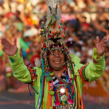 Arica, Chile - January 23, 2016: Tinkus dancing group in colourful costumes performing a traditional ritual dance as part of the Carnaval Andino con la Fuerza del Sol in Arica, Chile.