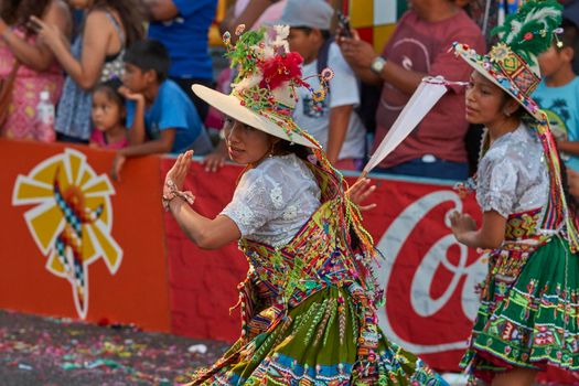 Arica, Chile - January 23, 2016: Tinkus dancing group in colourful costumes performing a traditional ritual dance as part of the Carnaval Andino con la Fuerza del Sol in Arica, Chile.