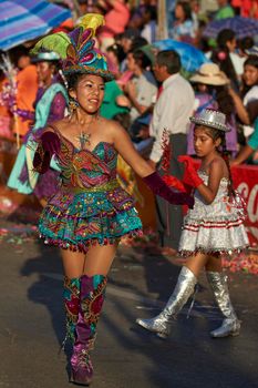 Arica, Chile - January 23, 2016: Morenada dance group performing a traditional ritual dance as part of the Carnaval Andino con la Fuerza del Sol in Arica, Chile.