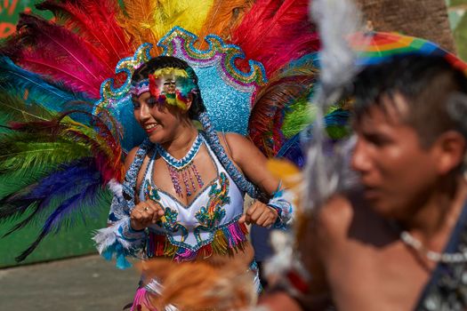 Arica, Chile - January 23, 2016: Tobas dancers in traditional Andean costume performing at the annual Carnaval Andino con la Fuerza del Sol in Arica, Chile.