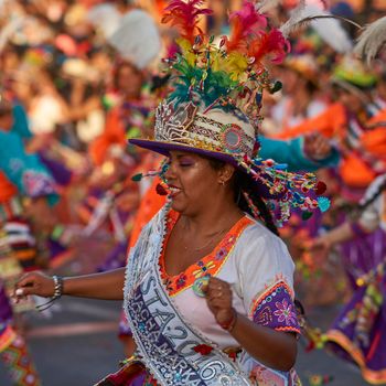 Arica, Chile - January 23, 2016: Tinkus dancing group in colourful costumes performing a traditional ritual dance as part of the Carnaval Andino con la Fuerza del Sol in Arica, Chile.