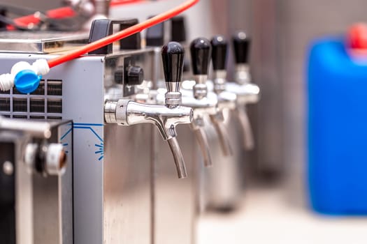beer tap equipment in a restaurant in a brewery. High quality photo