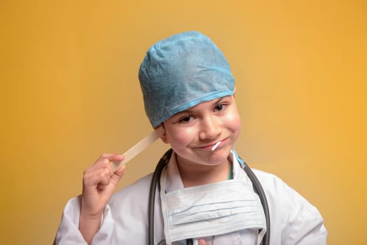 Cute child in doctor coat with stethoscope on color background. Space for text