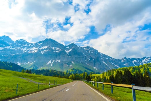 Road with snowy alps mountains, Schoenengrund, Hinterland, Appenzell Ausserrhoden Switzerland.