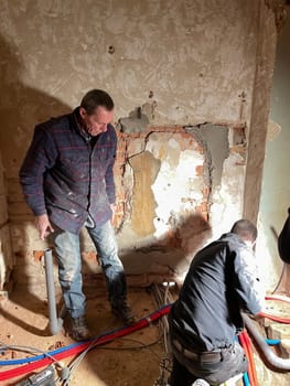 Electrician working working on building site, Maintenance technicians install wiring in the home. High quality photo