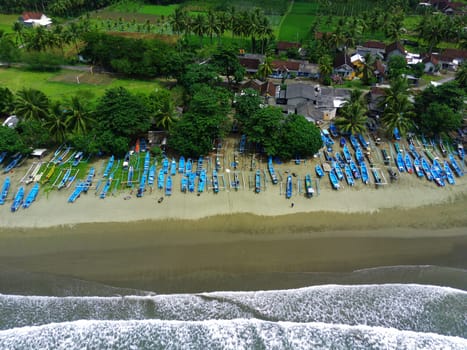 Aerial view of boats moored off Rajegwesi Beach. Banyuwangi. Indonesia. Photo taken with drone.