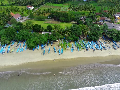Aerial view of boats moored off Rajegwesi Beach. Banyuwangi. Indonesia. Photo taken with drone.