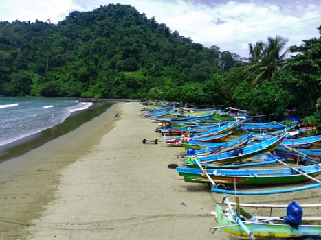 Aerial view of boats moored off Rajegwesi Beach. Banyuwangi. Indonesia. Photo taken with drone.