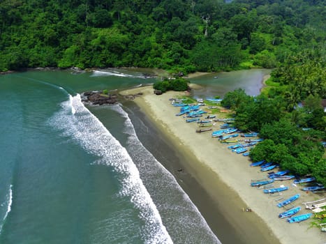 Aerial view of boats moored off Rajegwesi Beach. Banyuwangi. Indonesia. Photo taken with drone.
