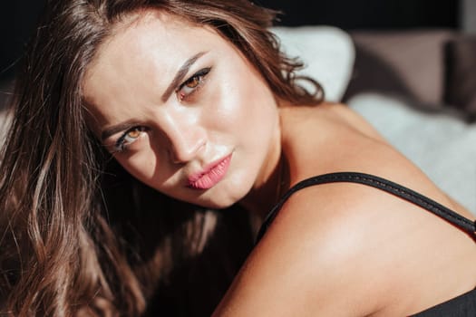Sensual portrait of a beautiful young woman with straight long hair. Beauty portrait of an attractive model.