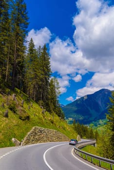 Road among Alps mountains, Klosters-Serneus, Davos, Graubuenden Switzerland.