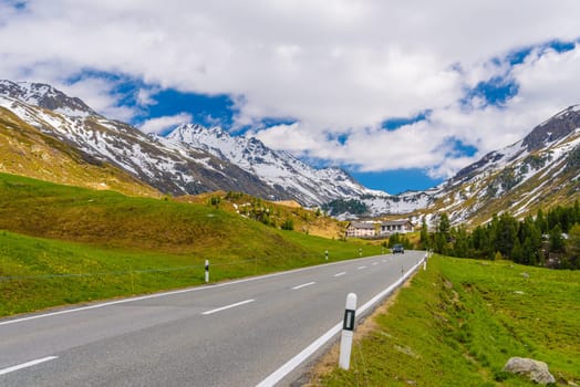 Road with Alps mountains, Samedan, Maloja Graubuenden Switzerland.
