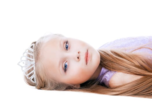 Portrait of beautiful little girl in tiara. Isolated on white
