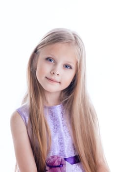 Portrait of beautiful blonde little girl in purple dress with long hairs Isolated