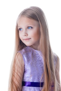 Portrait of beautiful blonde little girl in purple dress with long hairs look aside isolated