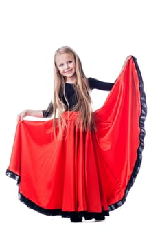 Full length portrait of little girl performing hispanic dance. Isolated on white