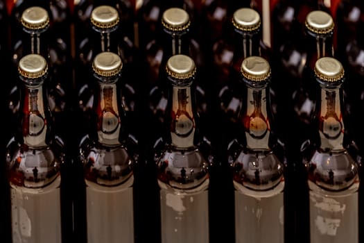 glass bottles with beer in the warehouse of the brewery. High quality photo