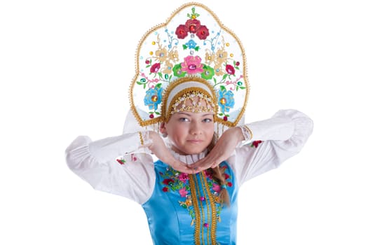Pretty young girl in kokoshnik. Isolated on white