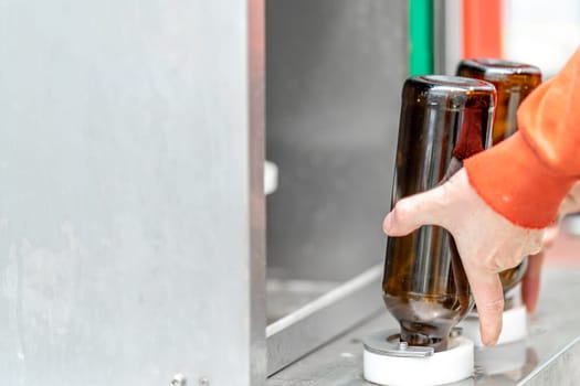 machine for automatic filling of beer bottles in a brewery. High quality photo