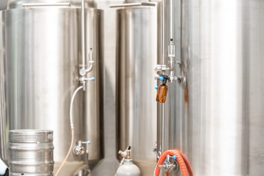 stainless steel tanks for brewing beer in a brewery.