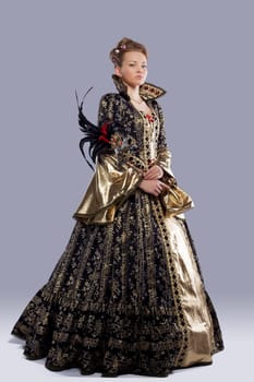 Full length portrait of young model in carnival costume middle age with mask