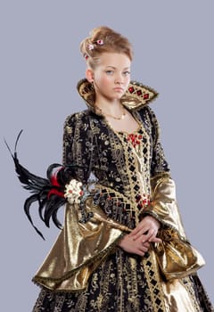 Full length portrait of pretty girl in carnival costume middle age like queen