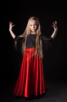 Full length portrait of pretty little girl performing hispanic dance