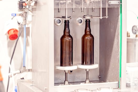 machine for automatic filling of beer bottles in a brewery. High quality photo