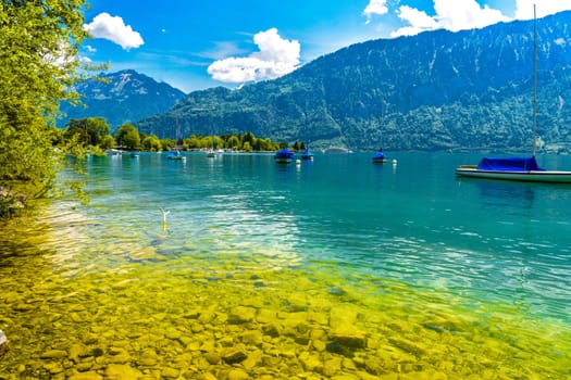 Boats and mountains on the Lake Thun, Thunersee Bern Switzerland.