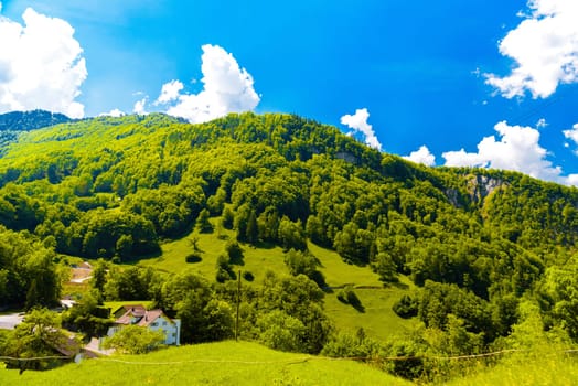 Houses and mountains near Lake Lungern, Lungerersee, Obwalden Switzerland.