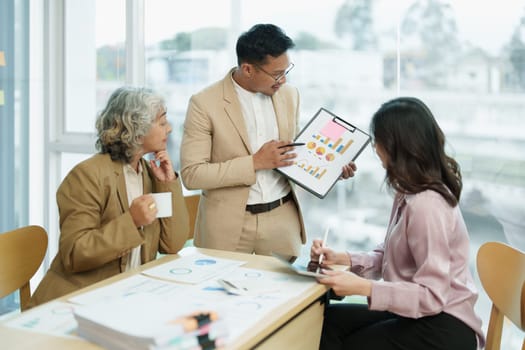 Asian entrepreneurs and business people meeting in a conference room in business planning, financial budget and investment risk assessment to analyze customer groups to increase company growth.