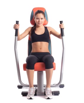 Brunette woman on orange hydraulic exerciser. Isolated on white
