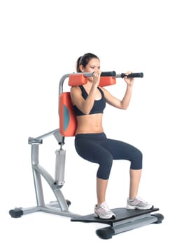 Sporty young woman on isodynamic exerciser. Isolated on white