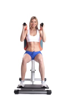 Beautiful blonde on isodynamic trainer, isolated on white
