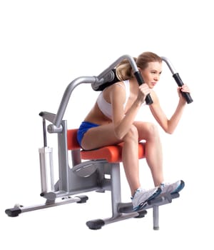 Blonde woman on isodynamic exerciser. Isolated on white
