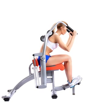 Slim woman on isodynamic exerciser. Isolated on white