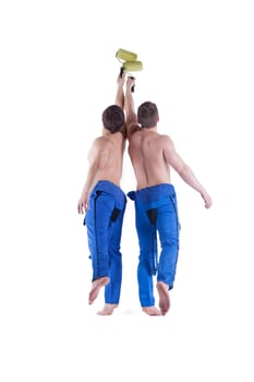 Rear view of sexy painters in blue overalls. Isolated on white