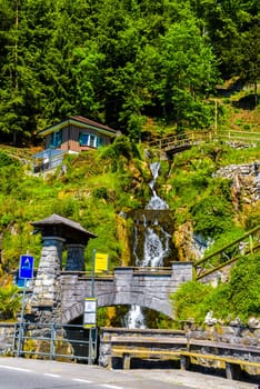 Waterfall on the cliff near Lake Thun, Thunersee in Bern, Switzerland.