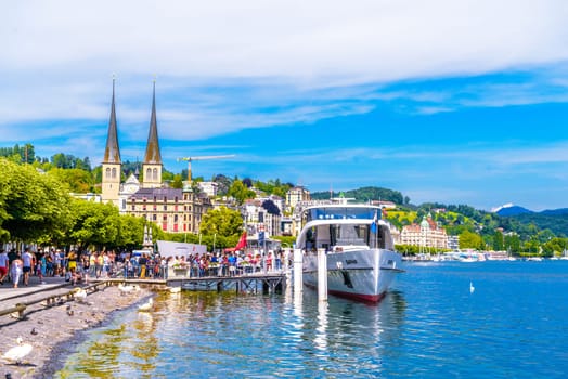 SWITZERLAND, LUCERNE - MAI 2017: Ship near the pier in the Lake Lucerne near city Lucerne, Luzern Switzerland.