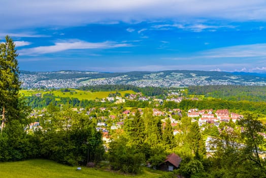 Houses and forests with meadows in Langnau am Albis, Horgen, Zurich, Switzerland.