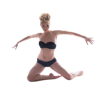 Attractive blonde posing in black underwear, isolated on white