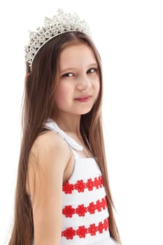 Portrait of charming little girl in crown, isolated on white