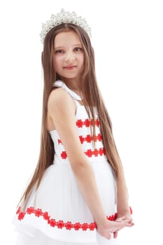 Smiling lovely girl posing in crown, isolated on white