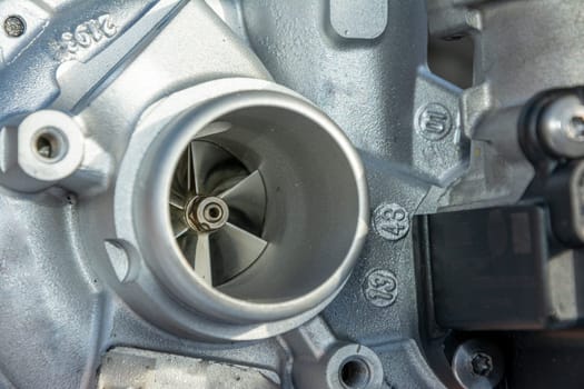 turbine impeller. new turbocharged car engine. A turbine for an automobile engine. Maintenance and repair of the car in the car service