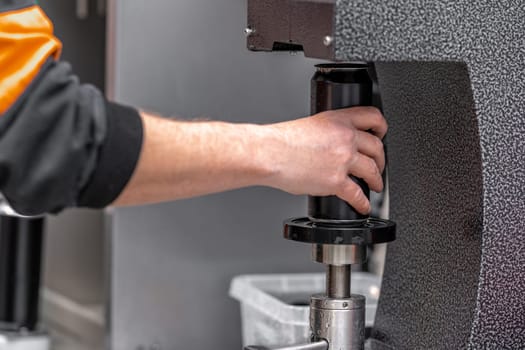 automatic filling and sealing of drink cans in the factory.